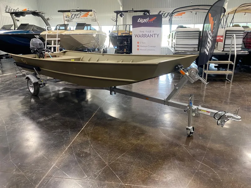 The Image of 2025 G3 Gator Tough 1648 LW boat on display in showroom with warranty sign. - 0