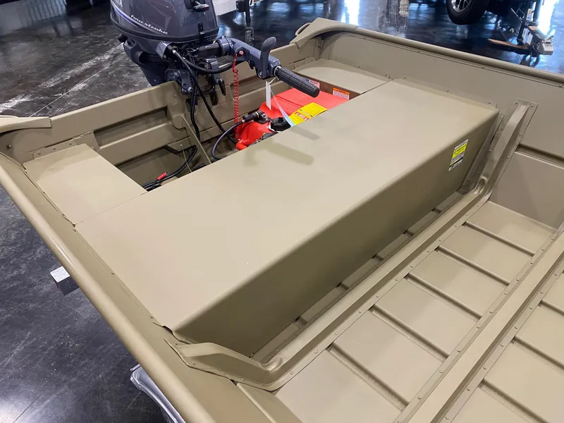 Slide: The Image of 2025 G3 Gator Tough 1648 LW boat interior with motor and fuel tank. - 2