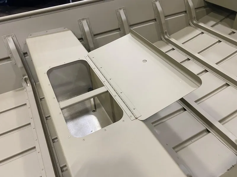 Slide: The Image of 2025 G3 Gator Tough 1648 LW boat interior with open storage compartment. - 4