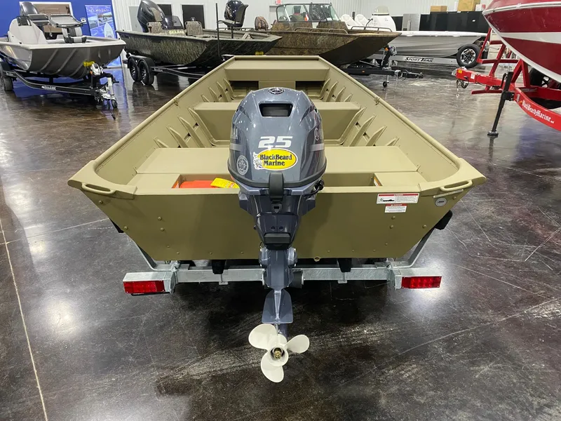 Slide: The Image of 2025 G3 Gator Tough 1648 LW boat with 25 HP outboard motor, displayed indoors. - 5
