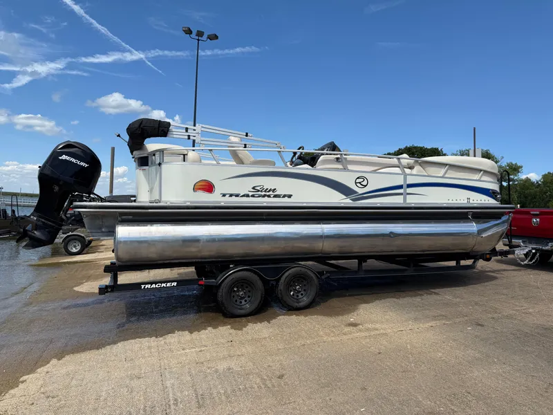 Slide: The Image of 2011 Sun Tracker Regency Party Barge 22 with outboard motor on trailer. - 15