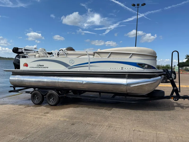 Slide: The Image of 2011 Sun Tracker Regency Party Barge 22 with Mercury outboard motor on trailer. - 17