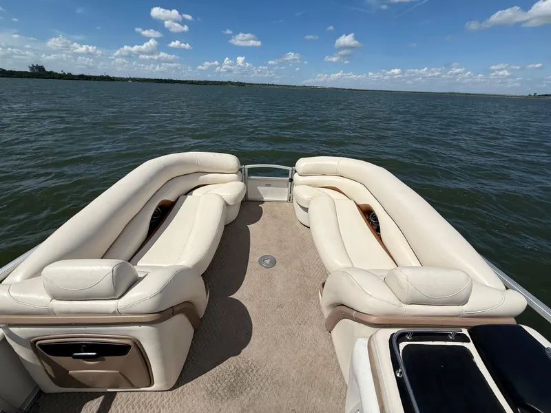 Slide: The Image of 2011 Sun Tracker Regency Party Barge 22 on trailer by the water. - 27