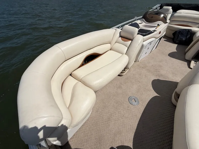 Slide: The Image of 2011 Sun Tracker Regency Party Barge 22 with spacious seating on a calm lake. - 30