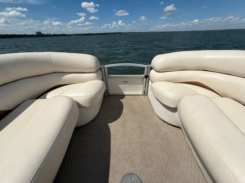 Slide: The Image of 2011 Sun Tracker Regency Party Barge 22 interior with beige seating on a sunny day. - 36