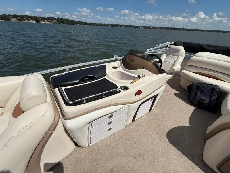 Slide: The Image of 2011 Sun Tracker Regency Party Barge 22 on calm green water. - 38