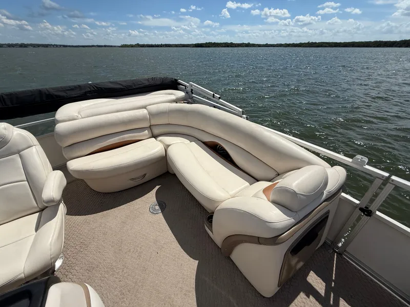 Slide: The Image of 2011 Sun Tracker Regency Party Barge 22 console with storage compartment and seating. - 43
