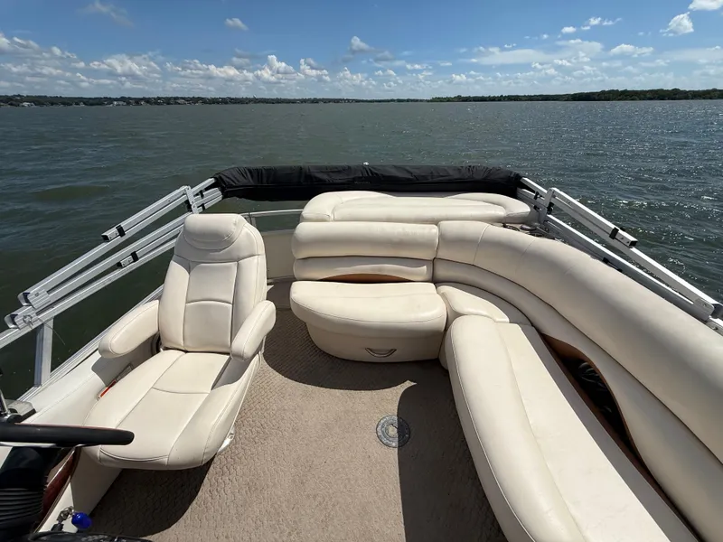 Slide: The Image of 2011 Sun Tracker Regency Party Barge 22 with plush seating on a sunny lake. - 44