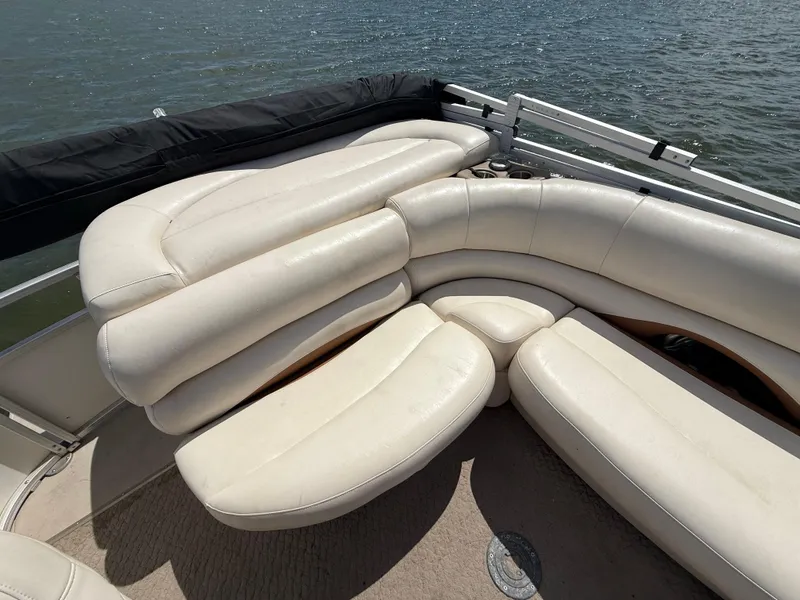 Slide: The Image of 2011 Sun Tracker Regency Party Barge 22 with plush seating on a scenic lake. - 47