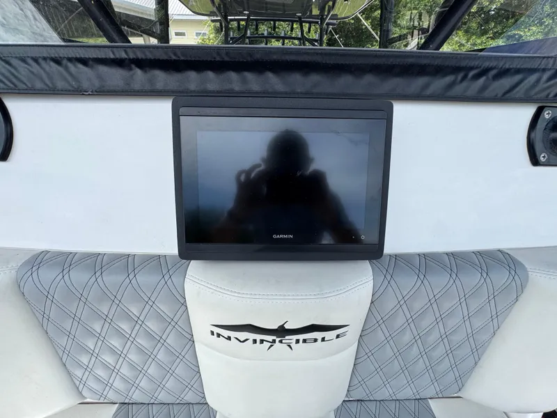 Slide: The Image of 2020 Invincible 40 Catamaran dashboard with Garmin display and quilted seating. - 28