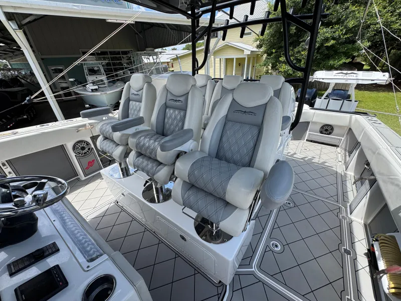 Slide: The Image of Luxurious seating on 2020 Invincible 40 Catamaran, featuring plush, diamond-stitched upholstery. - 29