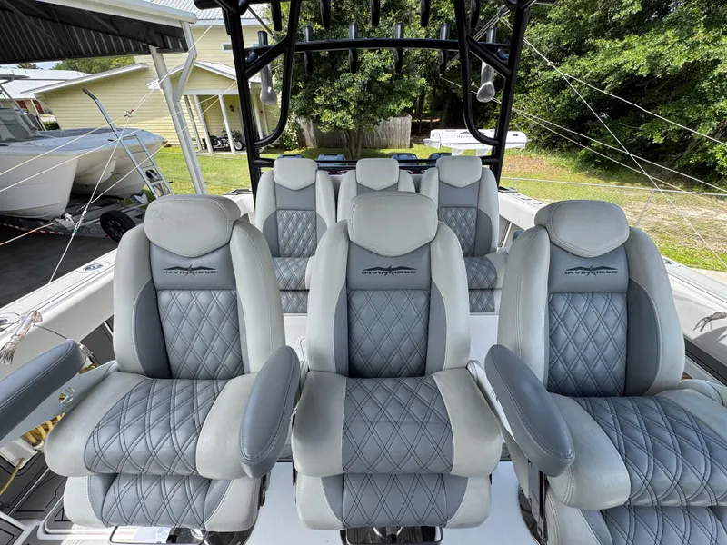 Slide: The Image of Luxurious seating on 2020 Invincible 40 Catamaran, featuring plush, diamond-stitched upholstery. - 30