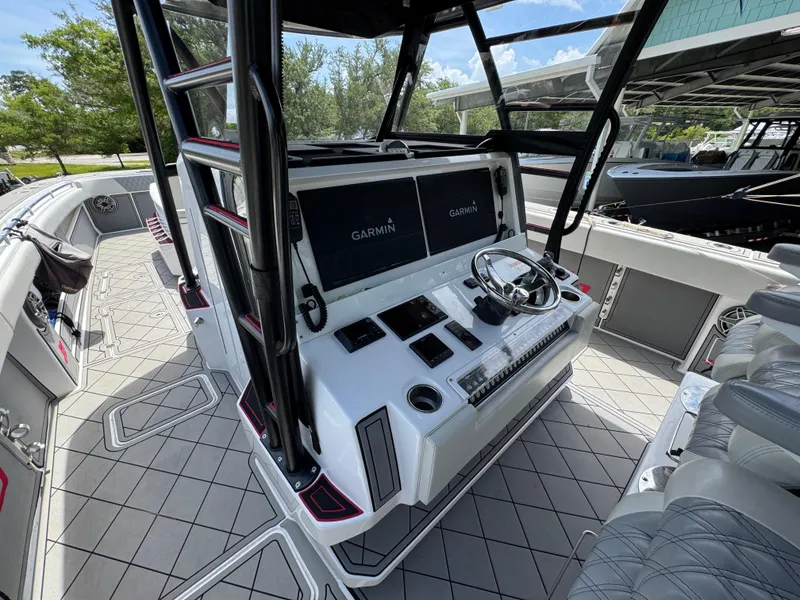 Slide: The Image of 2020 Invincible 40 Catamaran helm with Garmin displays and modern controls. - 32