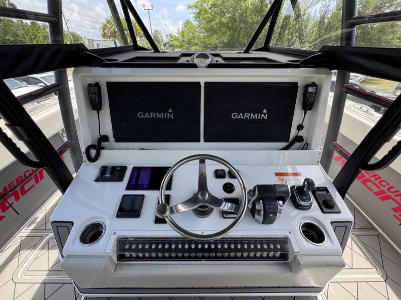 Slide: The Image of Cockpit of 2020 Invincible 40 Catamaran with Garmin displays and modern controls. - 33