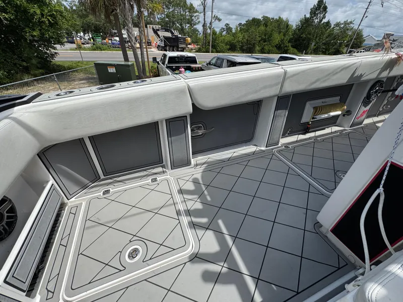 Slide: The Image of 2020 Invincible 40 Catamaran deck with cushioned seating and storage compartments. - 43