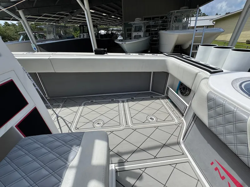 Slide: The Image of Interior view of 2020 Invincible 40 Catamaran, featuring sleek seating and modern design elements. - 44