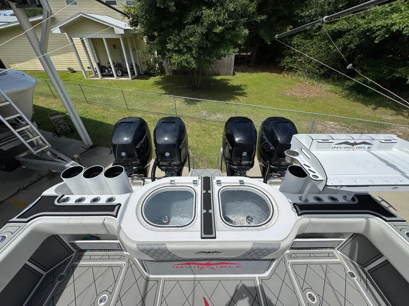 Slide: The Image of 2020 Invincible 40 Catamaran with four powerful outboard engines and dual livewells. - 46
