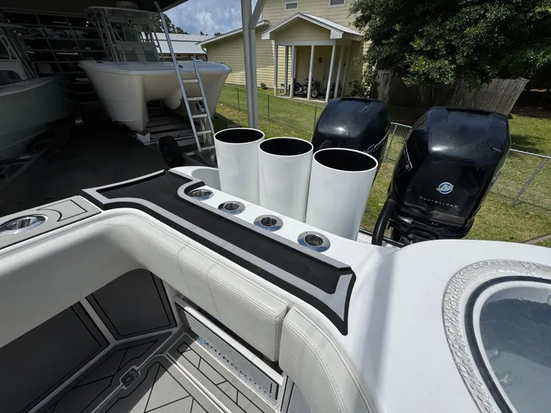 Slide: The Image of Invincible 40 Catamaran 2020 model with dual outboard motors and rod holders. - 48