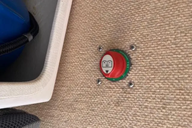 Slide: The Image of Red and green switch on Corsair Dash 750 boat, 2012 model, installed on carpeted surface. - 5