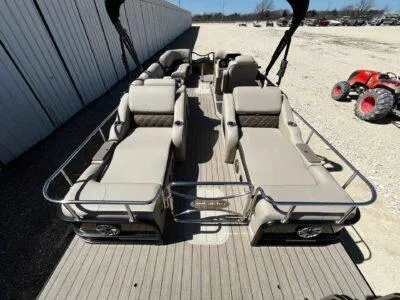 Slide: The Image of 2025 SunCatcher Elite 324 SS pontoon boat with spacious seating and modern design. - 11