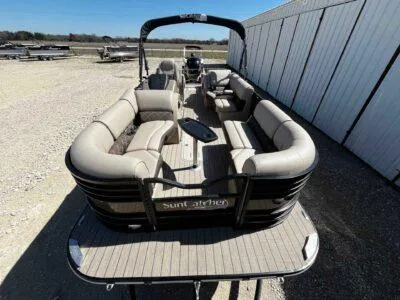 Slide: The Image of 2025 SunCatcher Elite 324 SS pontoon boat with spacious seating and modern design. - 8