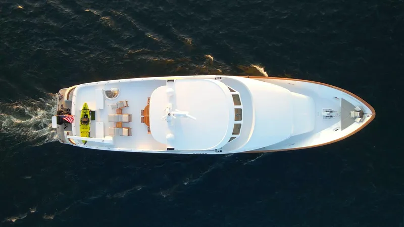 Slide: The Image of Aerial view of 1993 Queenship LRC yacht cruising on open water. - 1