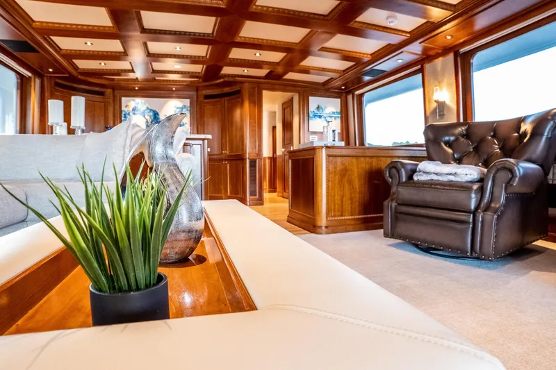 Slide: The Image of Luxurious 1993 Queenship LRC yacht interior with elegant wood paneling and plush seating. - 11