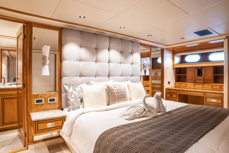 Slide: The Image of Luxurious 1993 Queenship LRC yacht bedroom with elegant woodwork and plush bedding. - 13