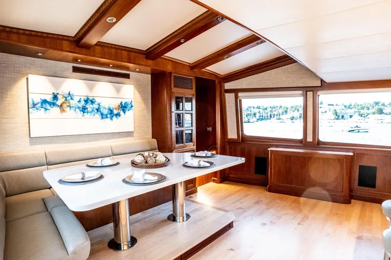 Slide: The Image of Luxurious 1993 Queenship LRC yacht interior with elegant dining area and scenic window views. - 18
