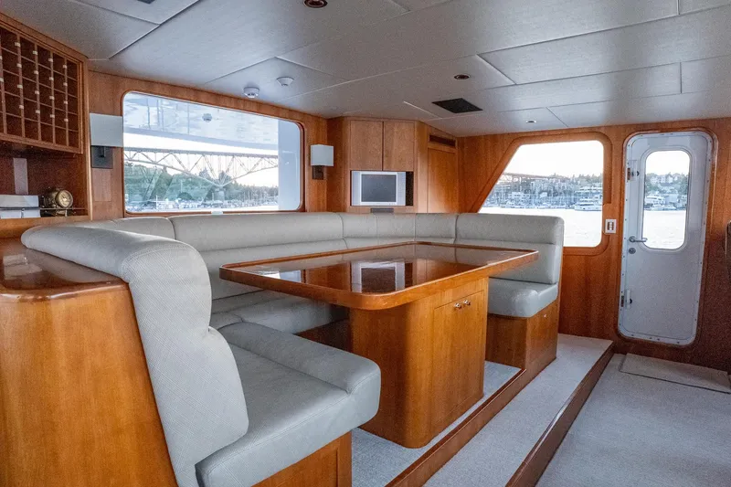 Slide: The Image of Luxurious 1993 Queenship LRC yacht interior with elegant wood finish and comfortable seating. - 19