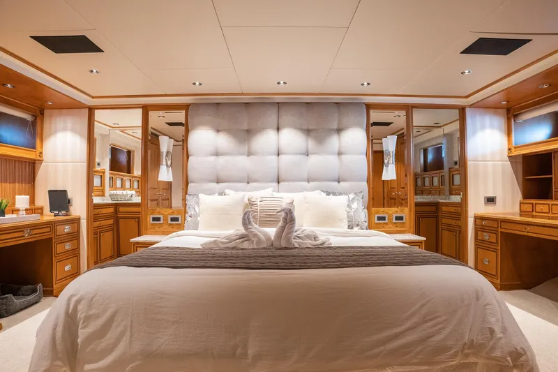Slide: The Image of Luxurious 1993 Queenship LRC yacht bedroom with elegant wood furnishings and plush bedding. - 20
