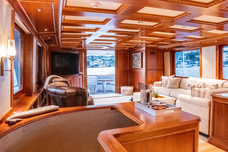Slide: The Image of Luxurious 1993 Queenship LRC yacht interior with elegant wood paneling and comfortable seating. - 23