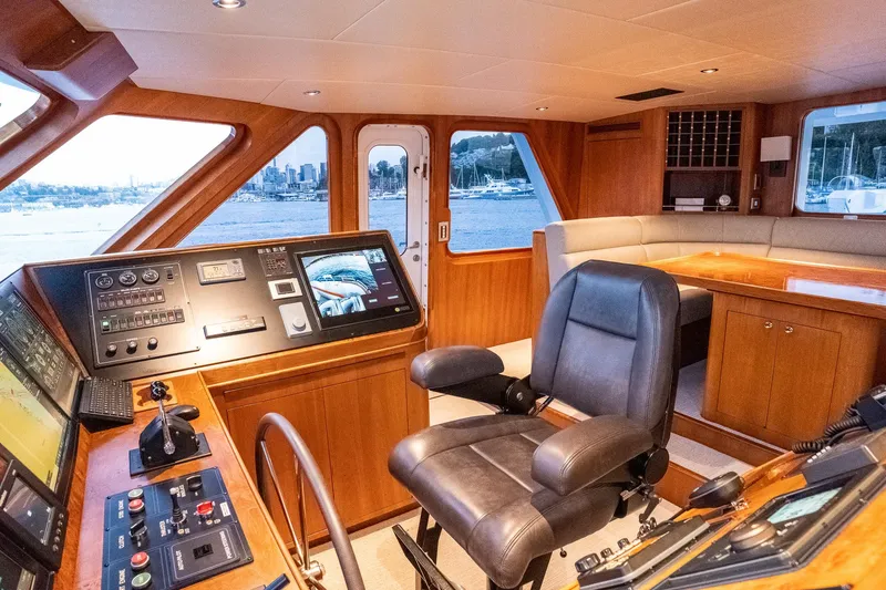 Slide: The Image of Luxurious 1993 Queenship LRC yacht interior with helm, leather chair, and panoramic windows. - 37