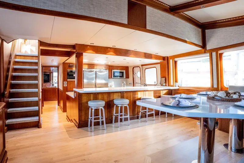Slide: The Image of Luxurious 1993 Queenship LRC yacht interior with modern kitchen and dining area. - 38