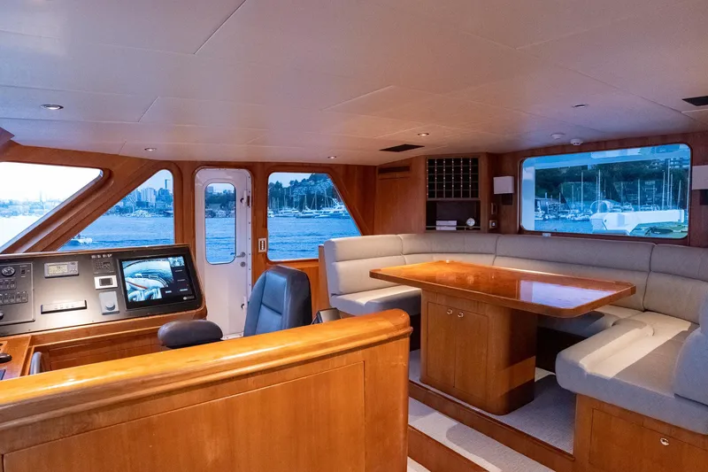 Slide: The Image of Luxurious 1993 Queenship LRC yacht interior with helm, seating, and dining area. - 40