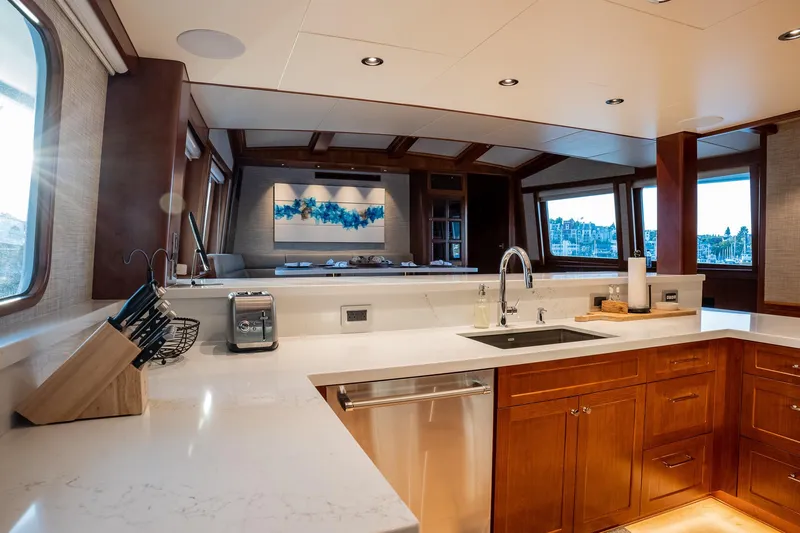 Slide: The Image of Luxurious 1993 Queenship LRC yacht kitchen with modern appliances and elegant wood cabinetry. - 42