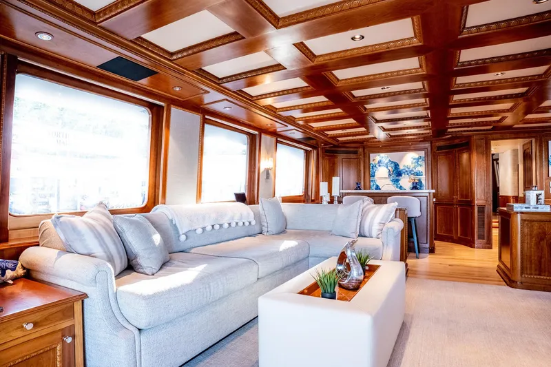 Slide: The Image of Luxurious 1993 Queenship LRC yacht interior with elegant wood paneling and plush seating. - 43