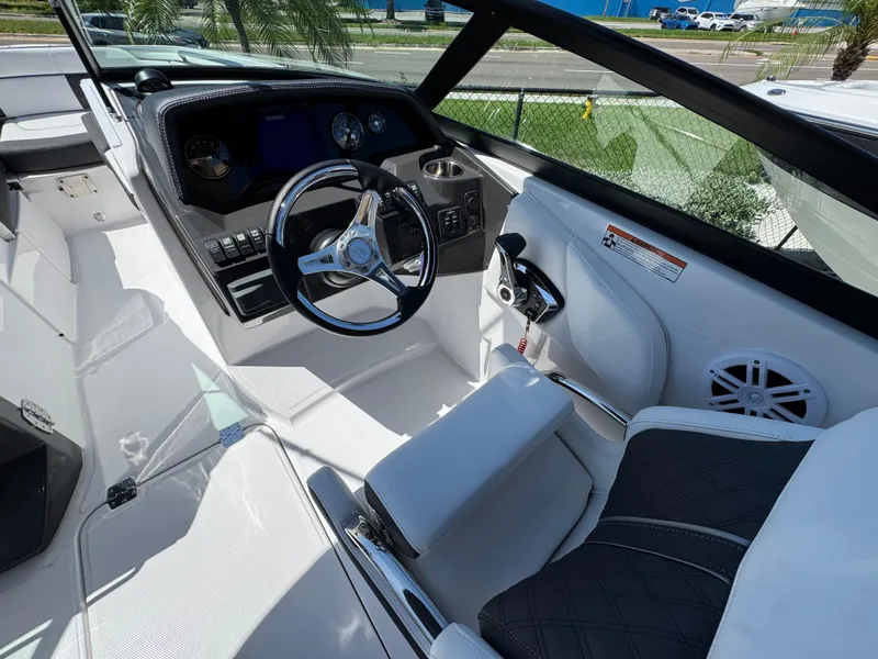 Slide: The Image of Interior of 2025 Monterey M-45 boat with sleek steering wheel and modern dashboard. - 10
