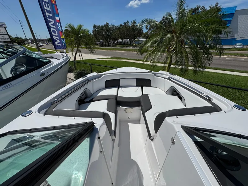 Slide: The Image of 2025 Monterey M-45 boat with spacious seating, displayed outdoors near palm trees. - 14