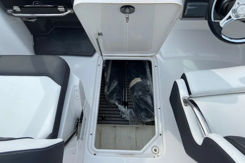 Slide: The Image of Interior of 2025 Monterey M-45 boat with open storage compartment. - 21