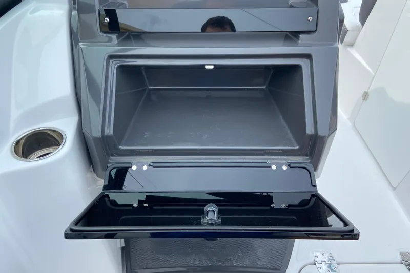 Slide: The Image of Open storage compartment on a 2025 Monterey M-45 boat, featuring sleek design and functionality. - 23