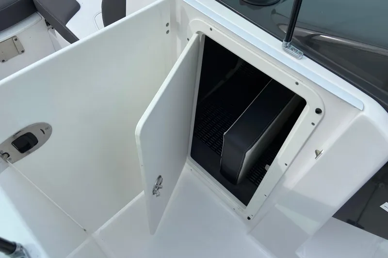 Slide: The Image of Open storage compartment on 2025 Monterey M-45 boat, showcasing interior space. - 26
