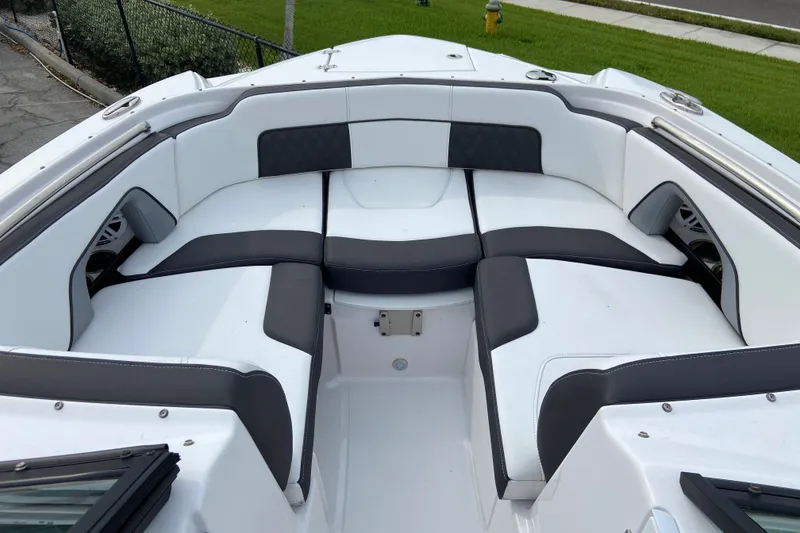 Slide: The Image of Luxurious seating area on a 2025 Monterey M-45 boat, featuring sleek white and gray upholstery. - 28