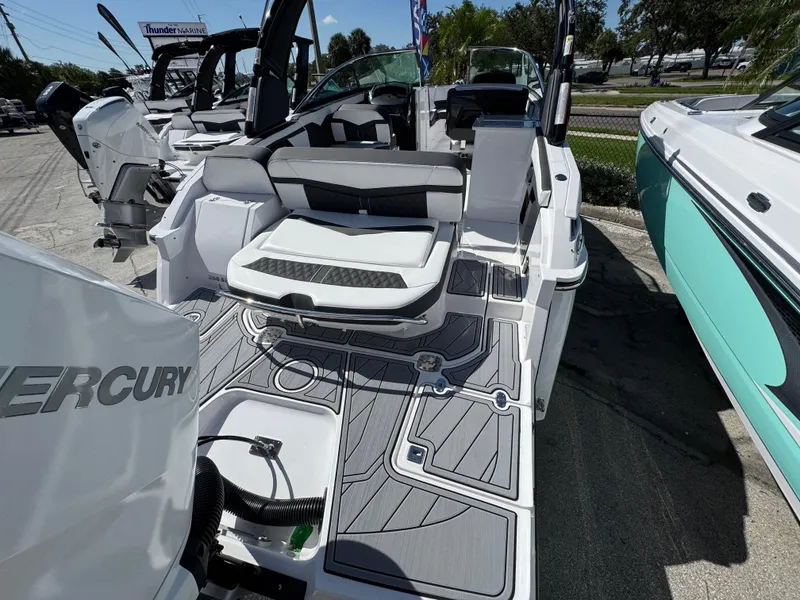 Slide: The Image of 2025 Monterey 255SS boat interior with seating and Mercury engine, displayed at Thunder Marine. - 3