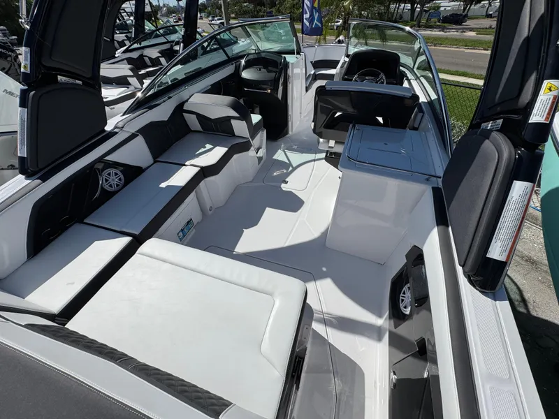 Slide: The Image of 2025 Monterey 255SS boat interior with sleek seating and modern design. - 4