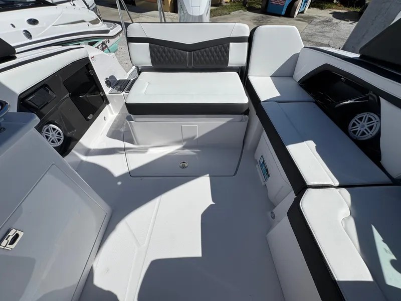 Slide: The Image of 2025 Monterey 255SS boat interior with white and black seating, modern design. - 5