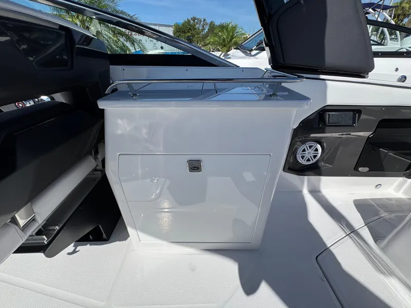 Slide: The Image of 2025 Monterey 255SS boat interior with sleek storage compartment and modern design. - 7