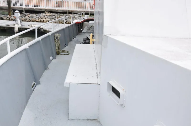 Slide: The Image of 1999 Rodriquez 50 Pilothouse boat deck with railing and dock view. - 10