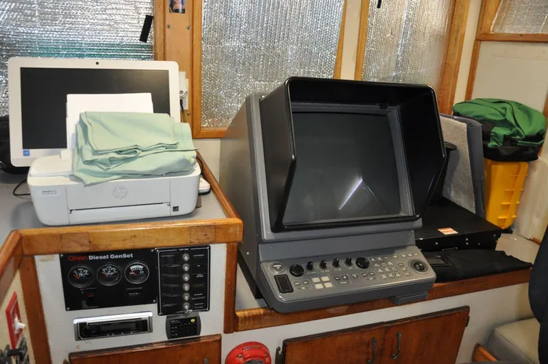 Slide: The Image of Control panel and equipment inside a 1999 Rodriquez 50 Pilothouse boat. - 25