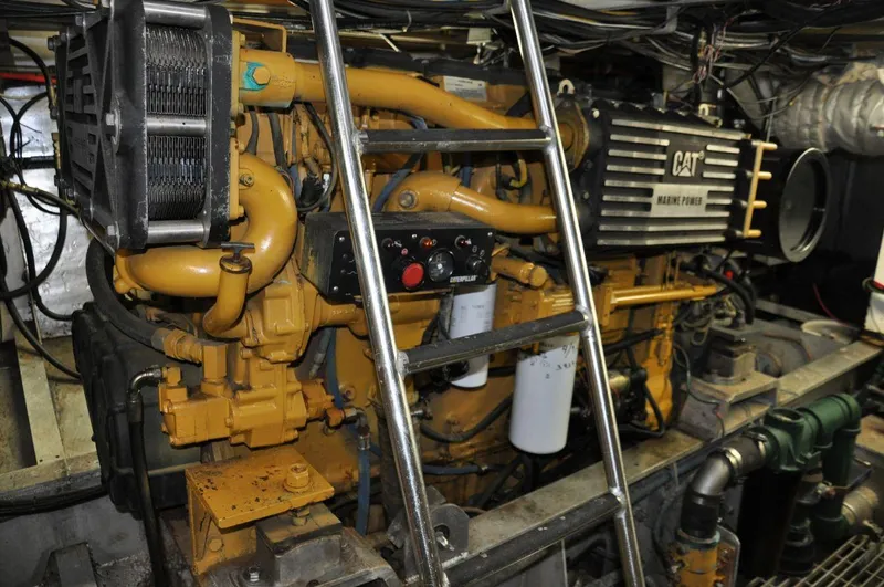 Slide: The Image of Engine room of 1999 Rodriquez 50 Pilothouse with CAT marine engine. - 32